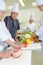 Chef watching student tie joint meat