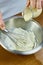 Chef whisk mayonnaise in a bowl in hand a series of full cooking food recipes