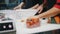 A chef working in the kitchen. Cherry tomatoes in the package