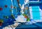Chefchaouen street in Morocco with blue walls and colorful flowerpots
