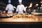 Chefs artistry in the kitchen, wood table defocused in the backdrop