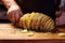 chefs hands potatoes into even slices