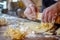 chefs hands rolling out homemade pasta dough