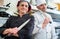 Chefs posing with knife in their restaurant kitchen