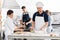 Chefs Preparing Pasta At Kitchen Counters