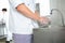 Chefs washing hands in industrial kitchen