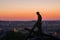 Chelm, Lubelskie, Poland - May 30, 2018: Jesus with a cross lying on the Way of the Cross on Mount Chelm - view during sunset on