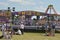 Cheltenham, United Kingdom - June 22, 2019 - Crowd of people in amusement park admiring diverse offers