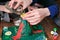 Chemical experiment. Close-up woman`s hands poured water from the bottle into the funnel of the volcano.