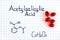 Chemical formula of Acetylsalicylic Acid with red pills.