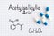 Chemical formula of Acetylsalicylic Acid with some pills.