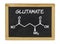 Chemical formula of glutamate on a chalkboard