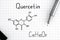 Chemical formula of Quercetin with black pen.