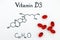 Chemical formula of Vitamin D3 and pills