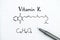 Chemical formula of Vitamin K with pen