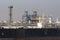 Chemical and oil products ship discharging cargo at a refinery.