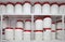 Chemical plastic barrels on shelves in storehouse