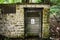 Chemical shed hidden in the forest near the research institue hospital with warning chemical danger sign on the door. Toxic