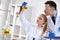 Chemical student researcher holding flask in laboratory