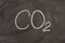 Chemical symbol for carbon dioxide on a blackboard