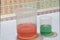 Chemicals in liquid form for educational purposes with the periodic table