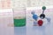 Chemicals in liquid form for educational purposes with the periodic table with molecule