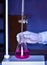 The chemist measures with precision in acid-base titration, adding solutions until neutralization