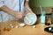 the chemist mixes the powder in a mortar by pestle.