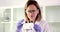 A chemist woman puts on protective glasses. close-up