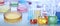 Chemistry and chemical research. Collage of different laboratory glassware with colorful liquids . Banner design