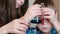 Chemistry experiments at home. Boy examines two liquids of different colors in a test tube and a flask.