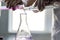 Chemistry expert is working with solutions and test tubes on the workbench in a chemistry laboratory. is a facility that provides