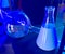 Chemistry flasks in blue light
