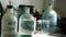 Chemistry laboratory with acid solutions in old glass flasks. Close up for the table with chemical solutions in the lab