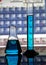 Chemistry laboratory conical flask and measuring cylinder on a reflecting surface and periodic table background