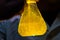 Chemistry laboratory yellow reaction solution flask