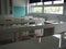 Chemistry room in a modern new school. Beautiful white furniture with sinks and washbasins. Large windows with blackout