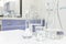 Chemistry Science laboratory flask, beaker and glassware with clear liquid chemical in blur background.