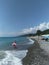 Chemitokvadzhe, Russia-June 24, 2019: a young woman walks along the edge of the sea in water with an inflatable pink circle at her