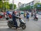 Chengdu city street, Chinese traffic jams at the crossroads, people on motobikes