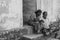 CHENNAI, INDIA - SEPTEMBER 28th, 2018: Senior couple sitting on the house step at black and white
