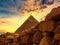 The Chephren pyramid behind a historic stone wall at Giza in Egypt