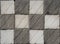 Chequered gray and white stone texture.