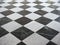 chequered white green and black stone floor background