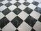 chequered white green and black stone floor background