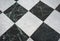 chequered white green and black stone floor background