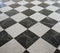chequered white green and black stone floor background