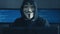 Cherkassy, Ukraine, January 10 2019: Anonymous Hacker in Black Hoodie Hiding his face under mask of Guy Fawkes showing