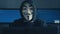 Cherkassy, Ukraine, January 10 2019: Dangerous Hacker Anonymous in mask of Guy Fawkes Showing You in dark room