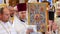 CHERKASY REGION, UKRAINE, OCTOBER 10, 2019: close-up, the priest holds a large church book in a beautiful golden binding